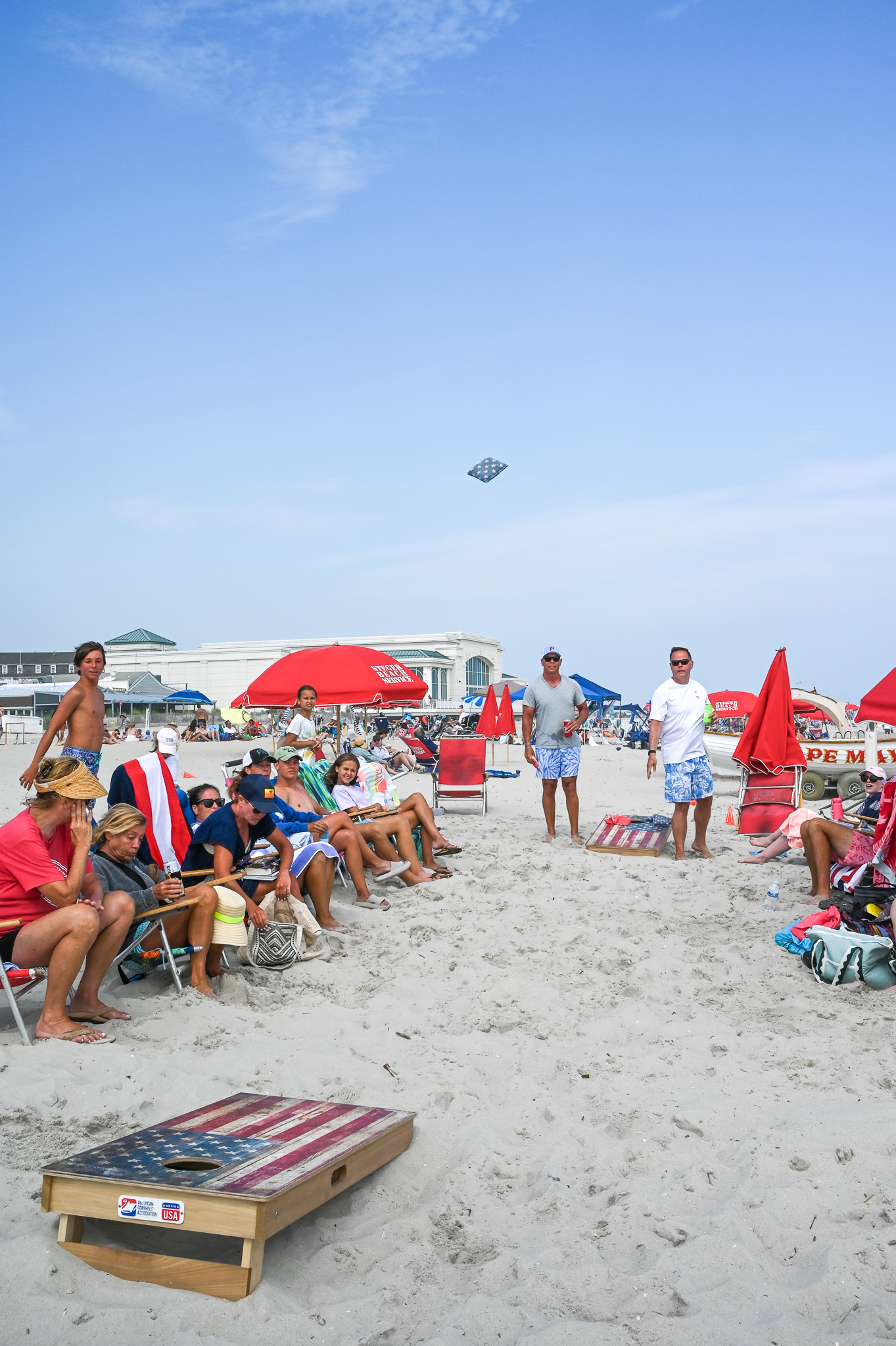 A family playing Cornhole on the beach in Cape May