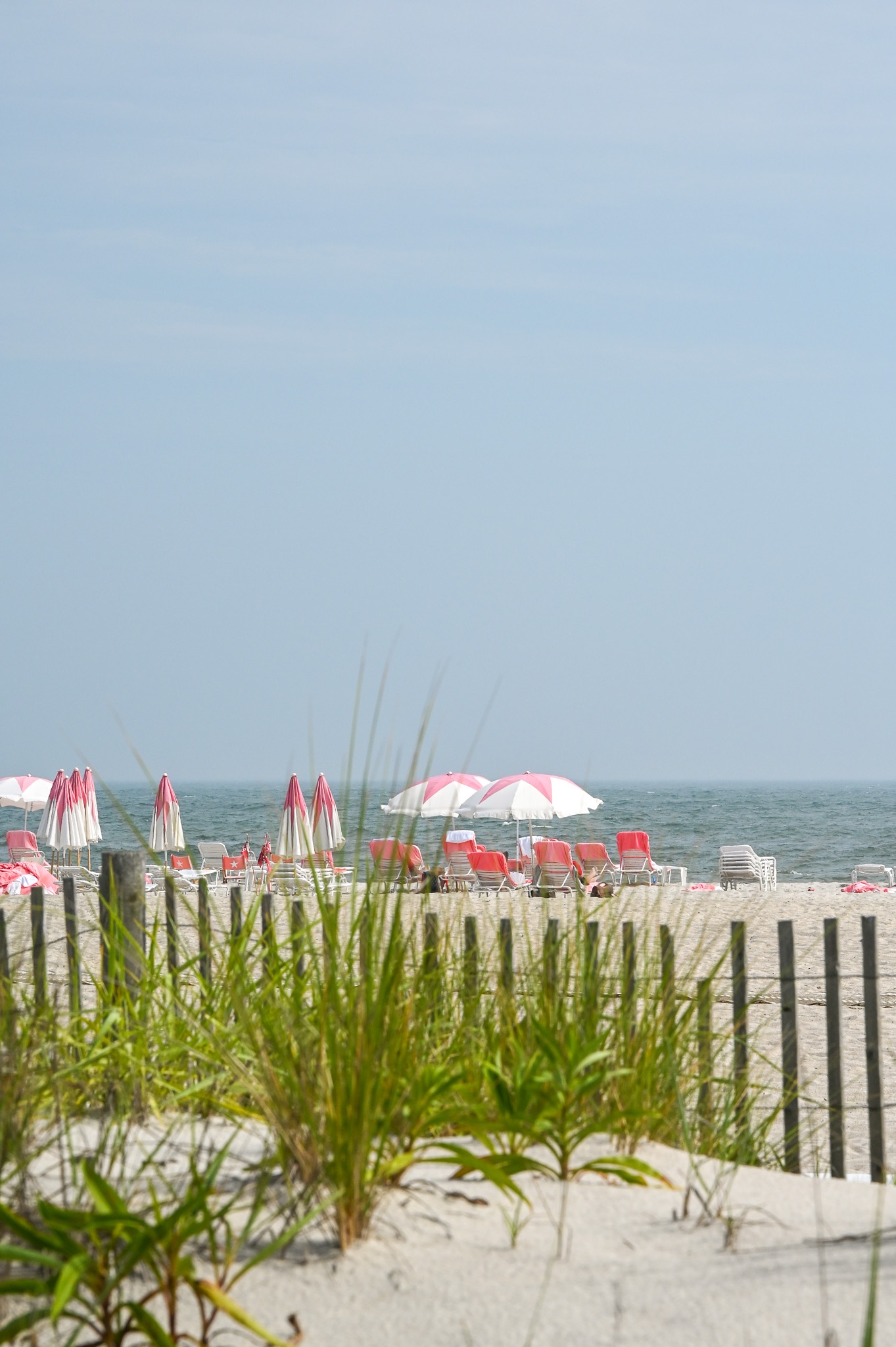 View From The Dunes of the Virginia beach chairs and umbrellas