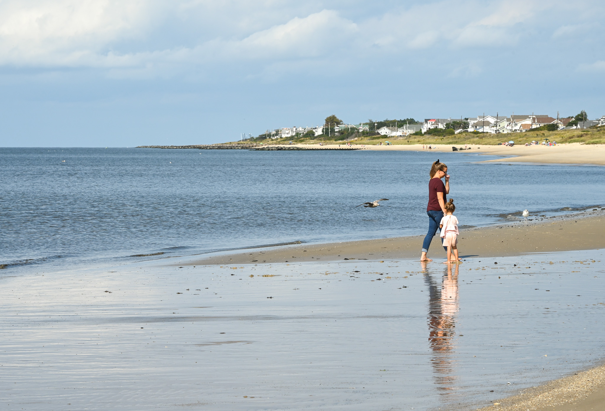 Mother & Daughter walking along the Delaware Bay