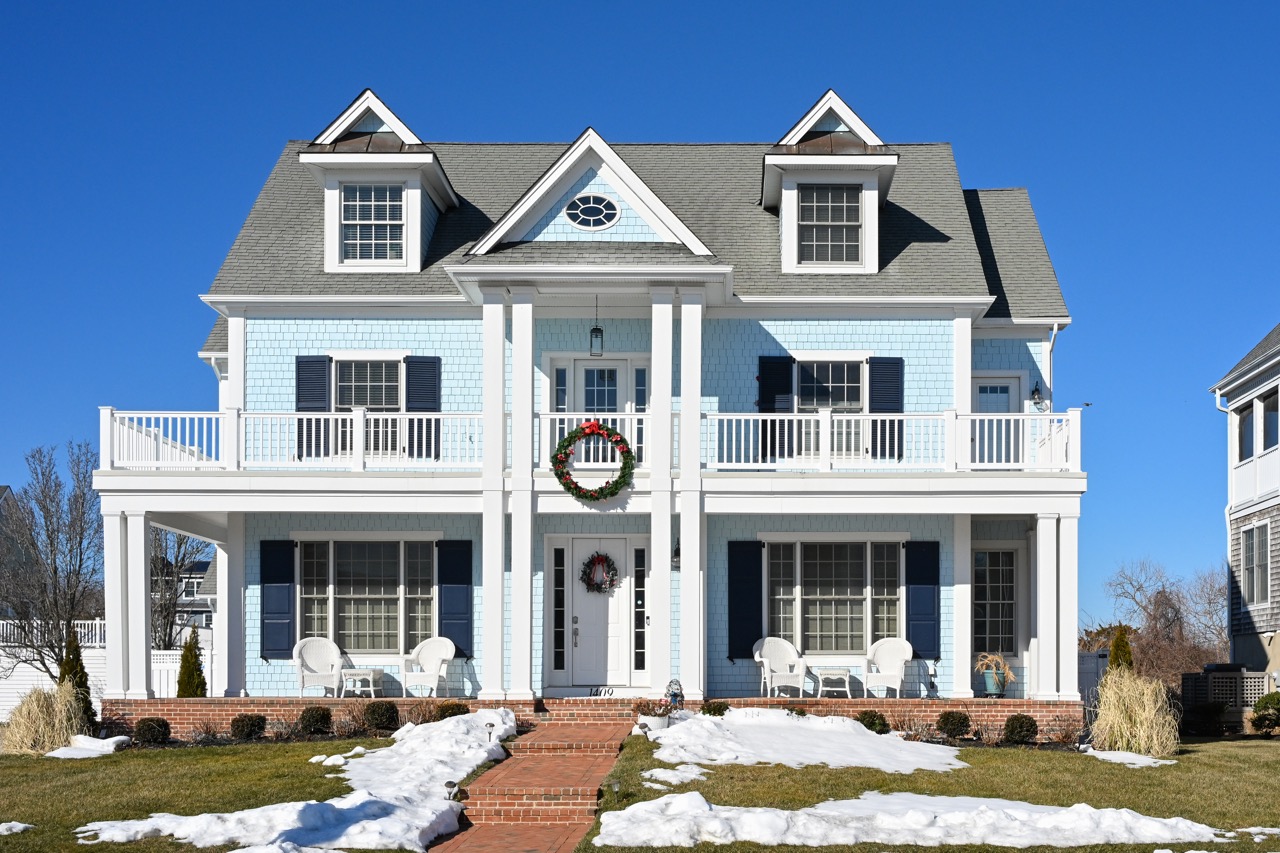 A blue house with a blue sky