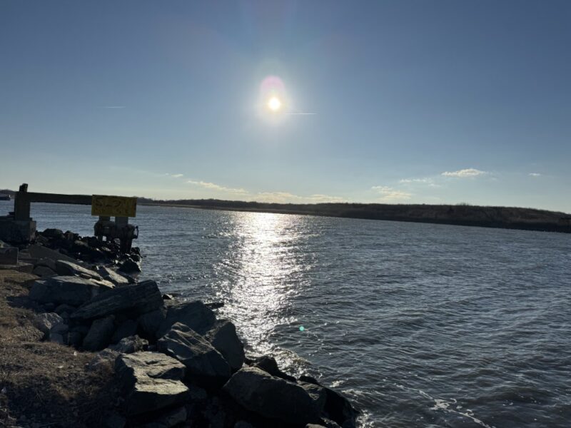 Sun Shining centered in the sky at the Ferry Intracoastal Waterway overlooking the jetty towards Higbees